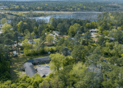 An aerial view of the Claremont Hills apartments. They are in a residential area surrounded by trees